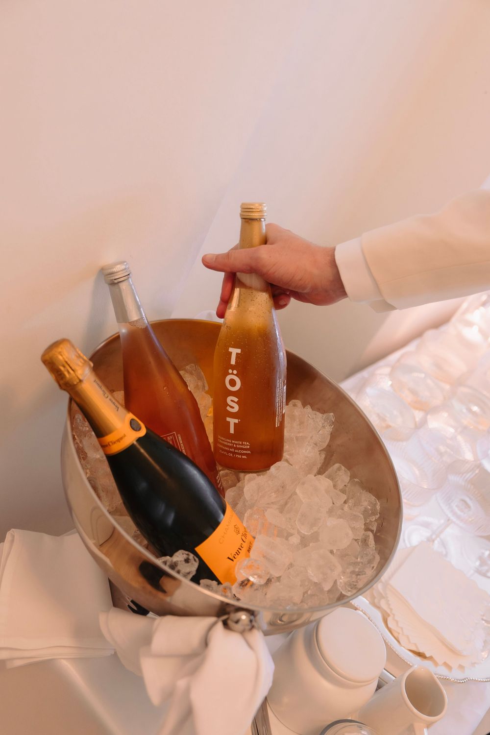 Champagne bottles chilling in ice bucket at elegant event.