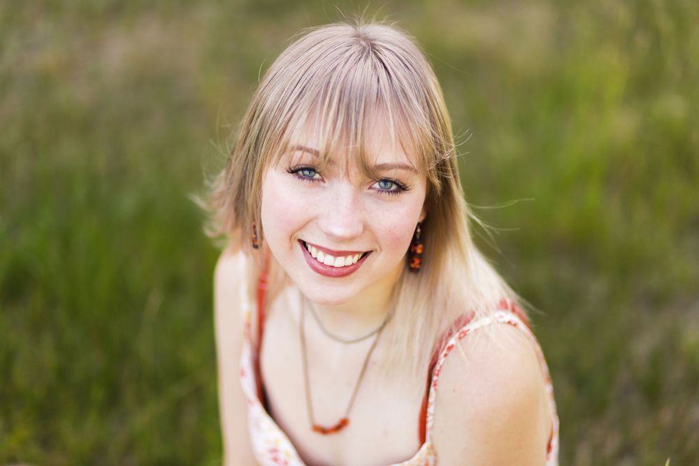 Senior portrait outdoors at a family cabin in Northern Wisconsin
