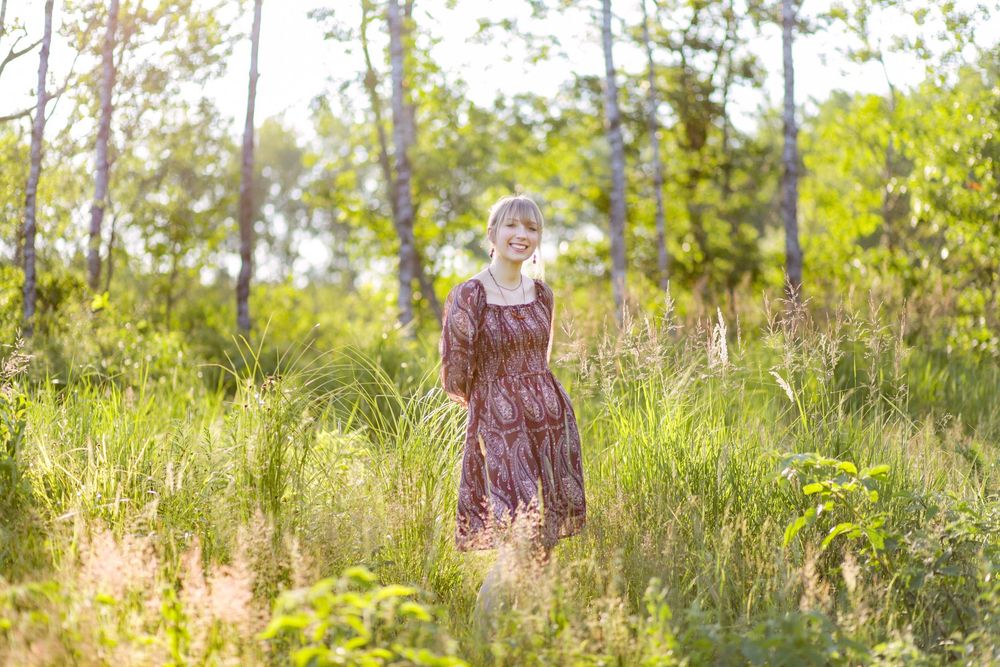 Senior portrait outdoors at a family cabin in Northern Wisconsin