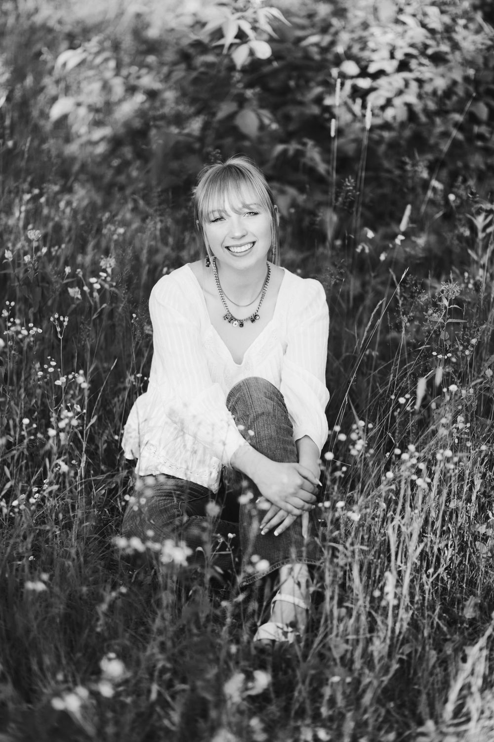 Senior portrait outdoors at a family cabin in Northern Wisconsin