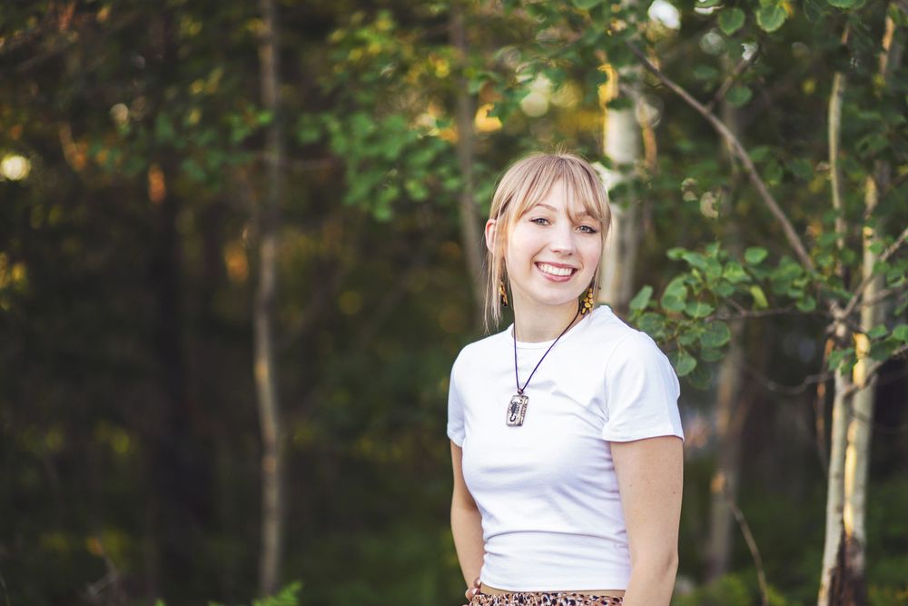 High school senior portraits at a family lake cabin