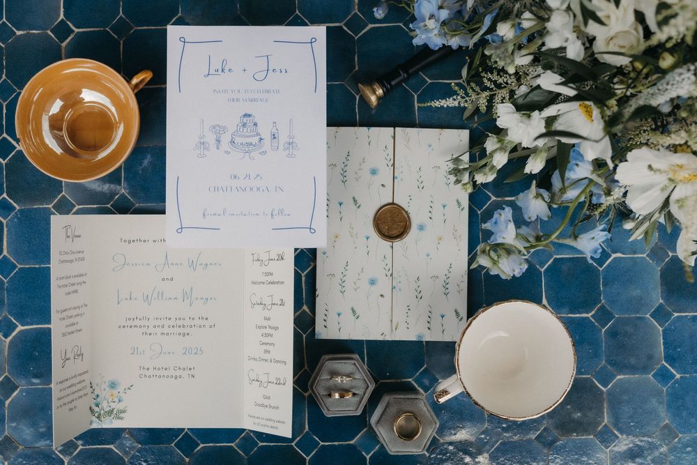 Coffee cup and handwritten notes displayed on blue tiled surface with natural lighting.