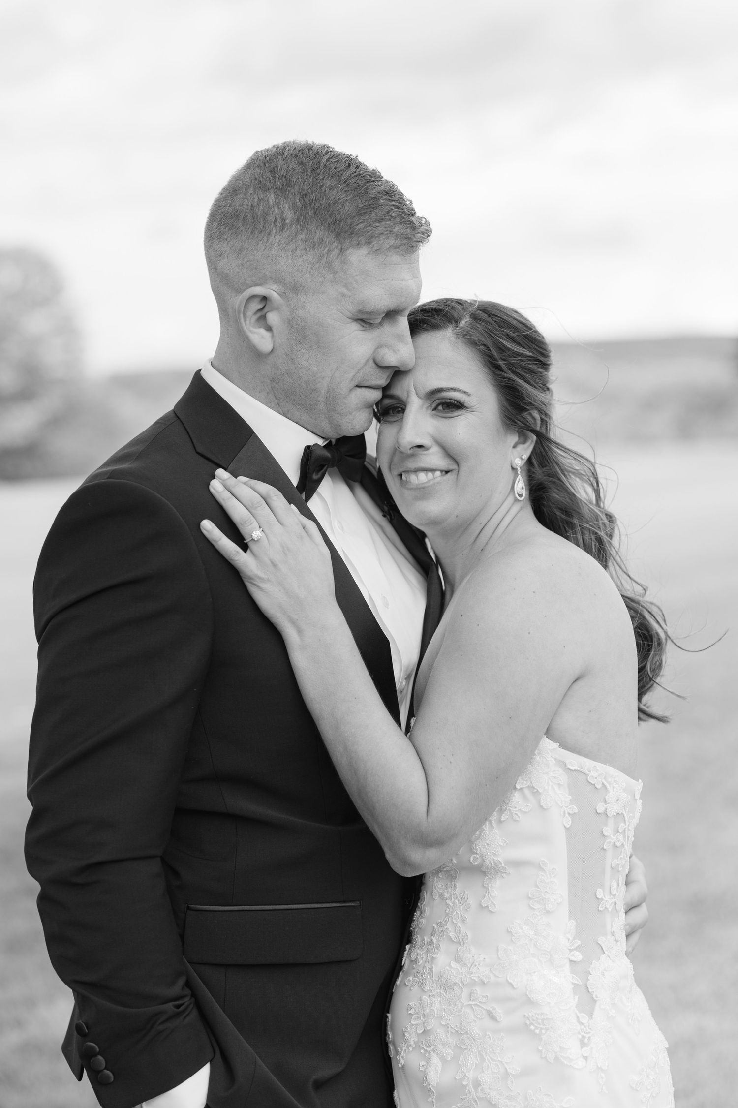A person in a white lace wedding dress with visible arm tattoos looks upward in a sequence of candid moments.