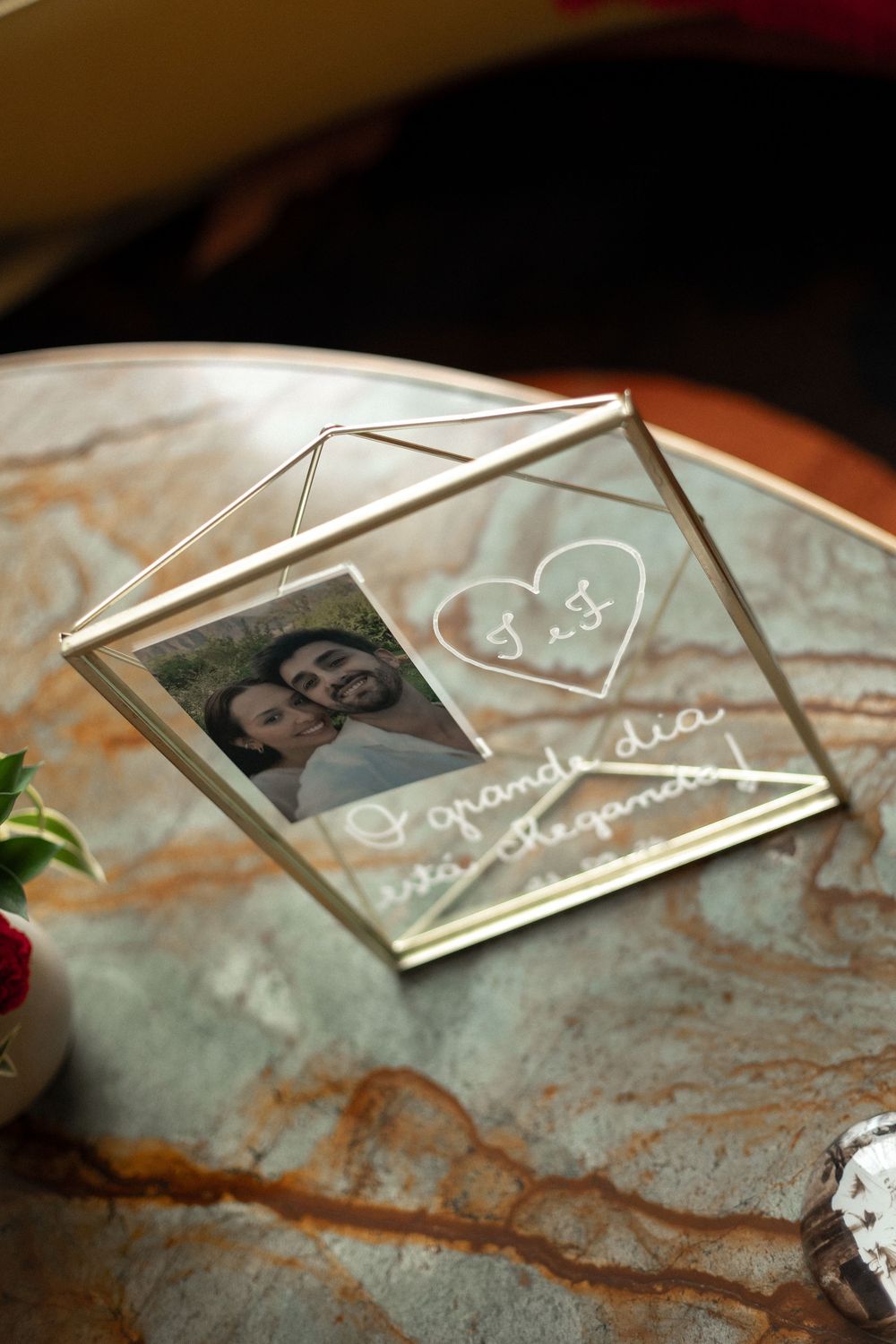 Small photo prints laid out on a textured surface show cherished memories in a nostalgic display.