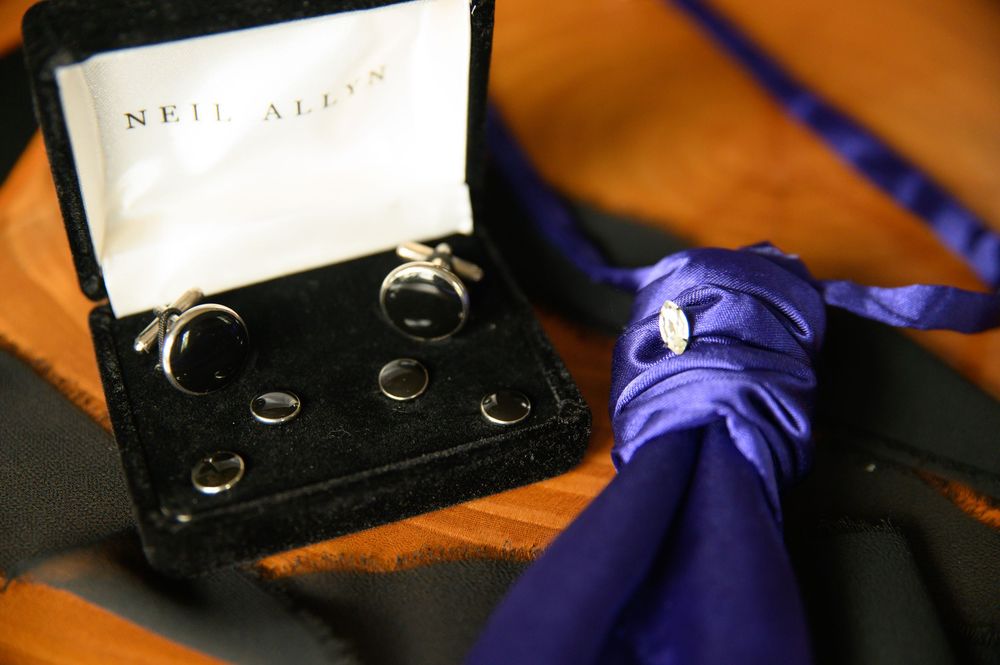 A series of macro shots showing purple nitrile gloves handling a black fountain pen nib.