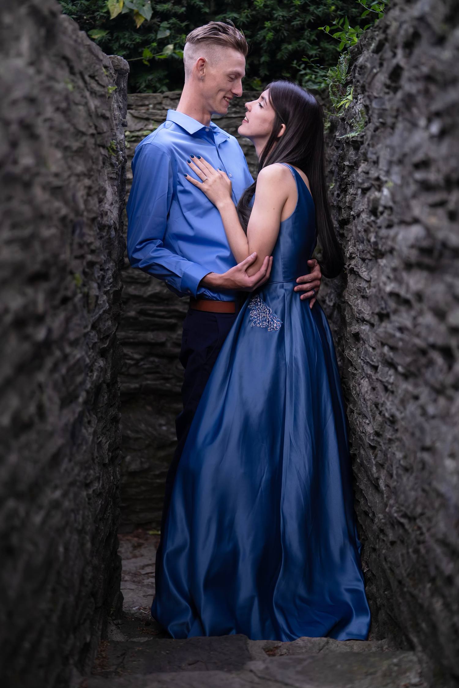 A romantic couple posing for an engagement session