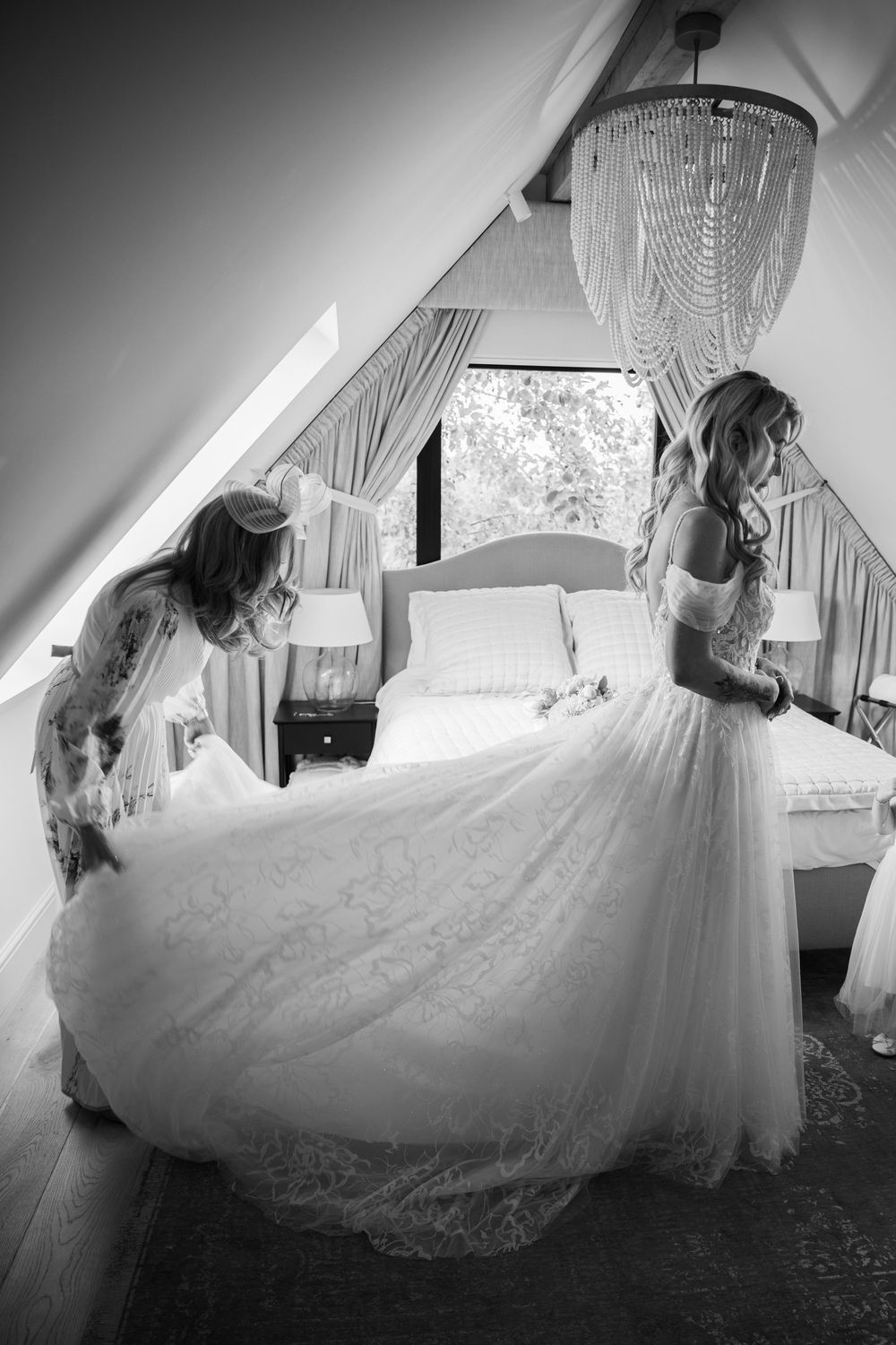 Series of black and white photos showing a flowing white wedding dress in a sunlit room with curtains.