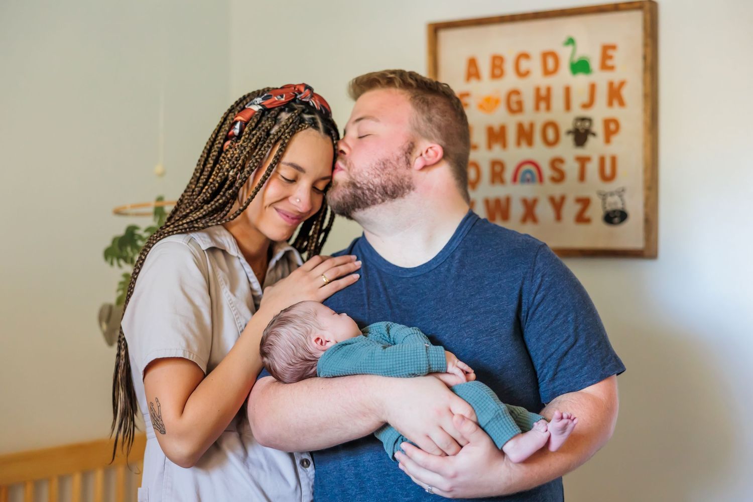 A series of candid moments between a couple in their home with an alphabet board visible in the background.