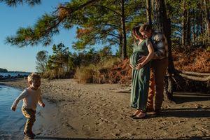 A collection of scenic beach photos showing people walking along a sandy shoreline with pine trees in the background.