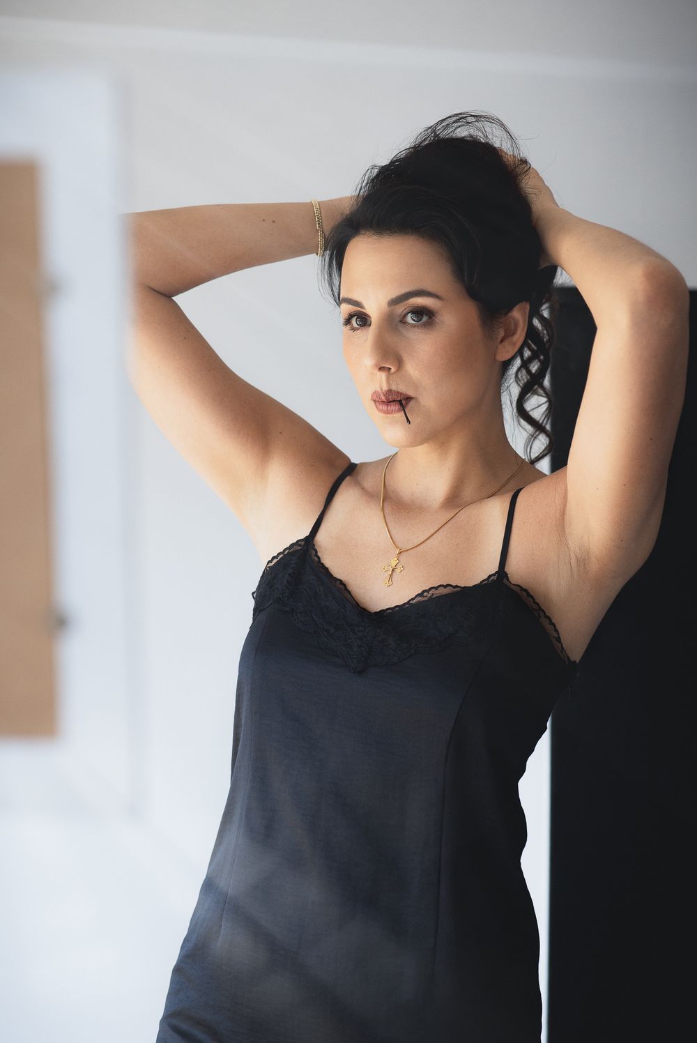 Elegant studio portrait of a woman celebrating her natural beauty.