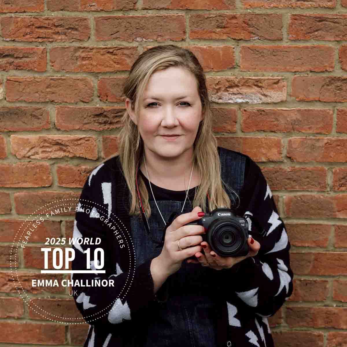 A headshot of Emma Challinor, Family Photographer based in Marlow, with her camera. Image taken at home, Marlow Buckinghamshire.