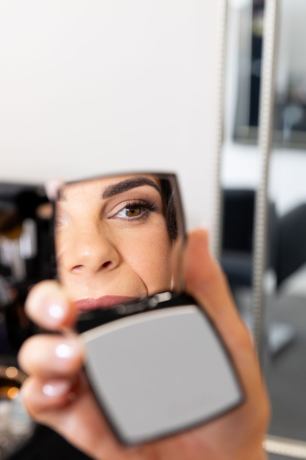 bride getting ready, looking in the mirror