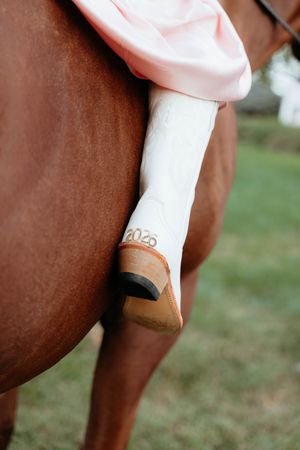 Close-up view of a person's arm wearing a white medical bracelet with 2020 printed on it.