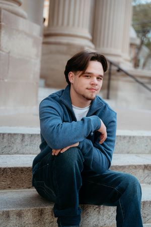 A person in a blue jacket sits contemplatively on stone steps in a series of artistic portrait shots.