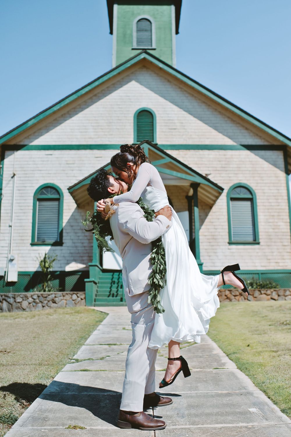 A sequence of five photos showing someone in white clothing crouching down to inspect a sidewalk in front of a house.