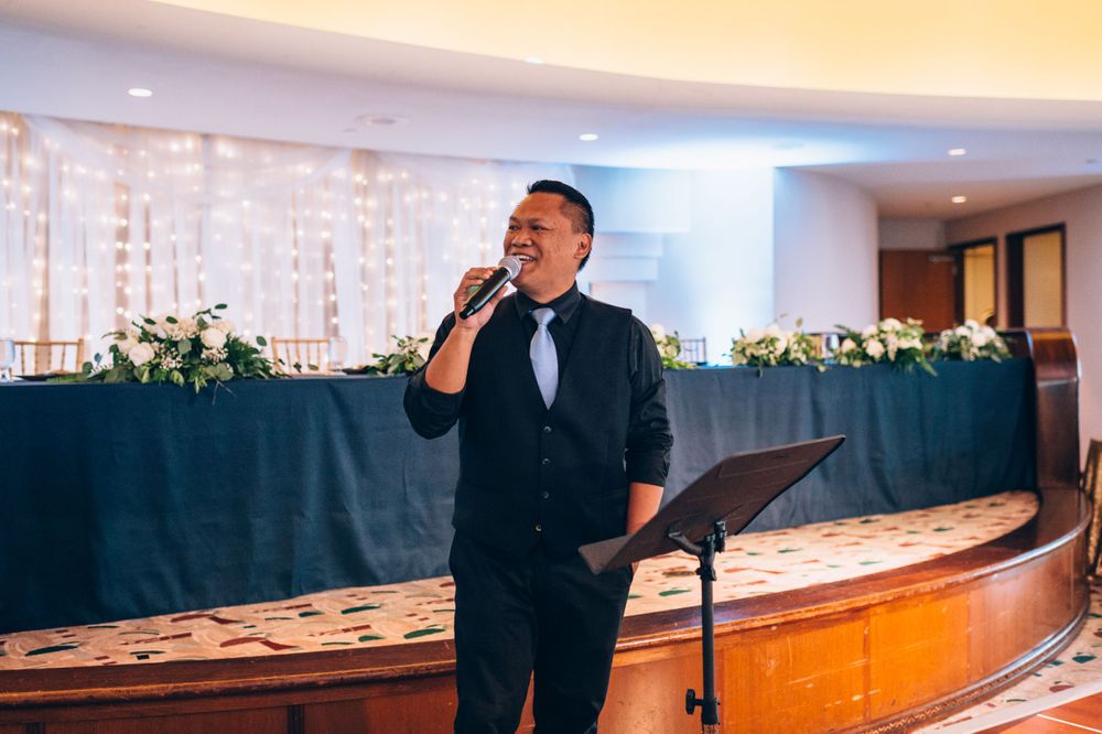 Wedding entertainment performers on stage during reception celebration.