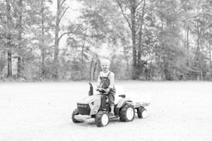 toddler on his tractor