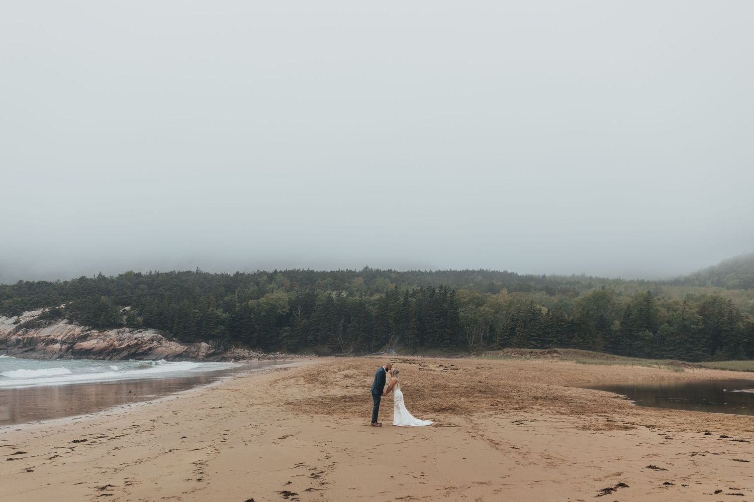 Misty coastal landscape with dramatic cliffs and ocean views.
