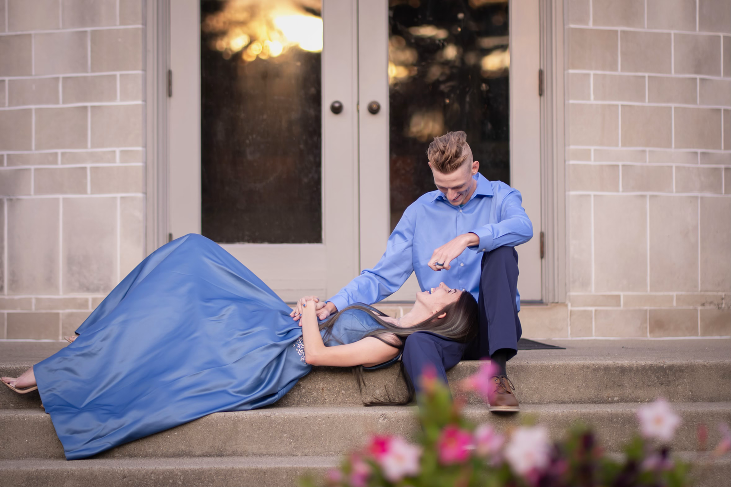 A couple pose for their engagement photos