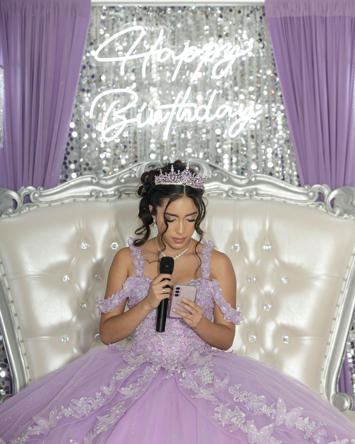 A quinceañera celebration shows a father-daughter dance in a lavender ballgown at an elegant ballroom venue.