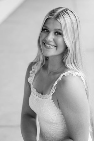Portrait series in black and white showing elegant lace top against light background.