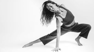 A black and white photo series showing a person in various expressive dance poses against a white background.