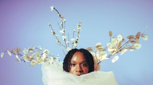 Six artistic photographs arranged in a row show ethereal white cherry blossoms against soft purple and blue backgrounds.