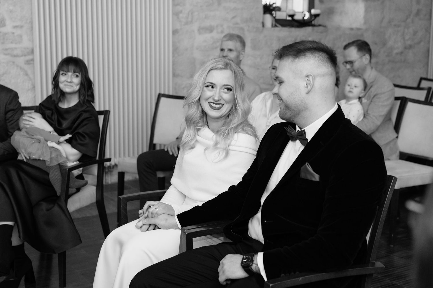 Wedding celebration candid moments captured in black and white photography.