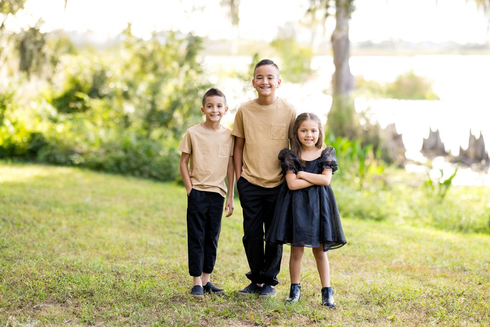 A series of outdoor family portraits showing adults and children posing together in a natural setting at sunset.