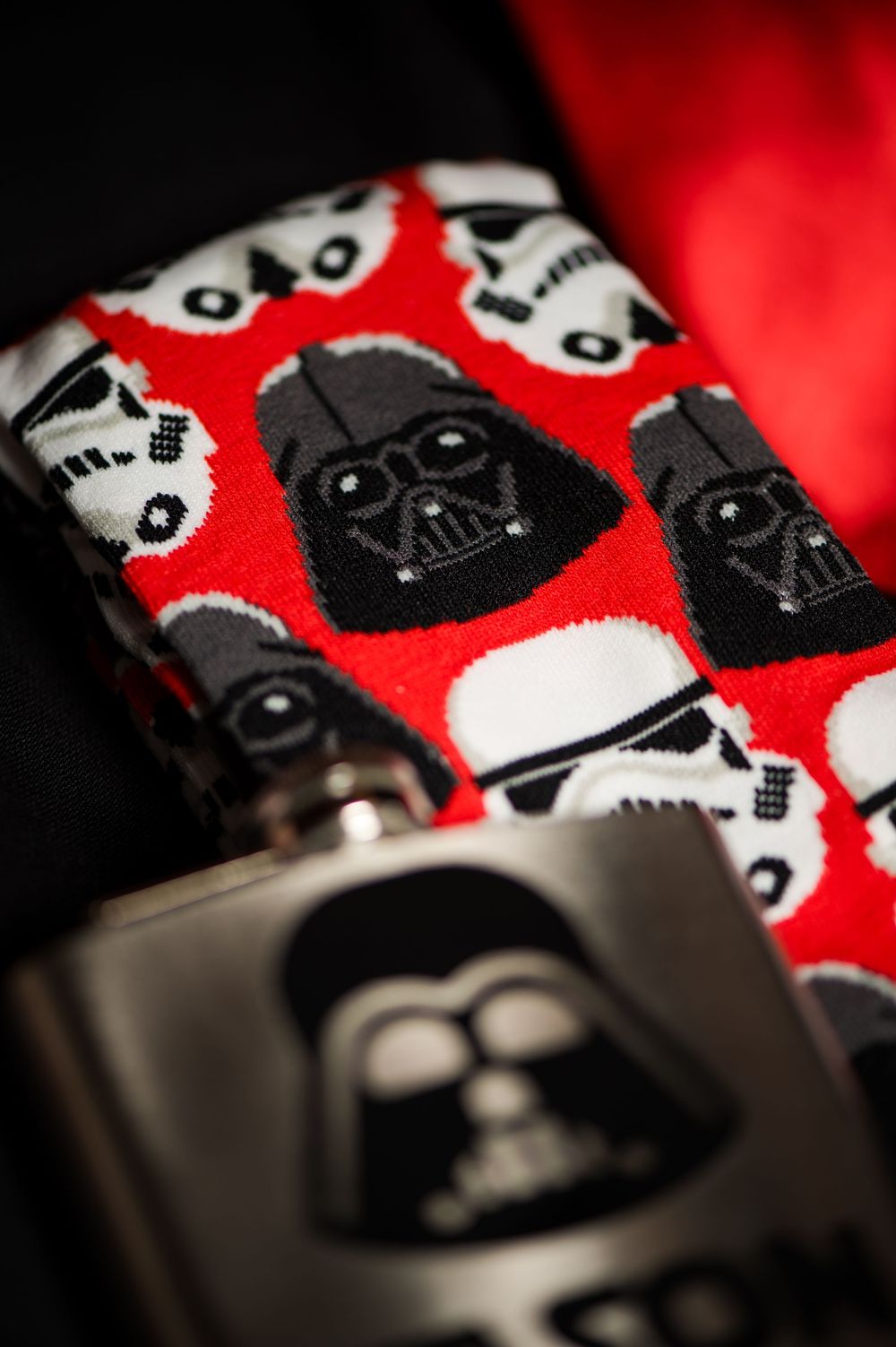 Star Wars Darth Vader themed pattern on red fabric with Stormtrooper helmets.