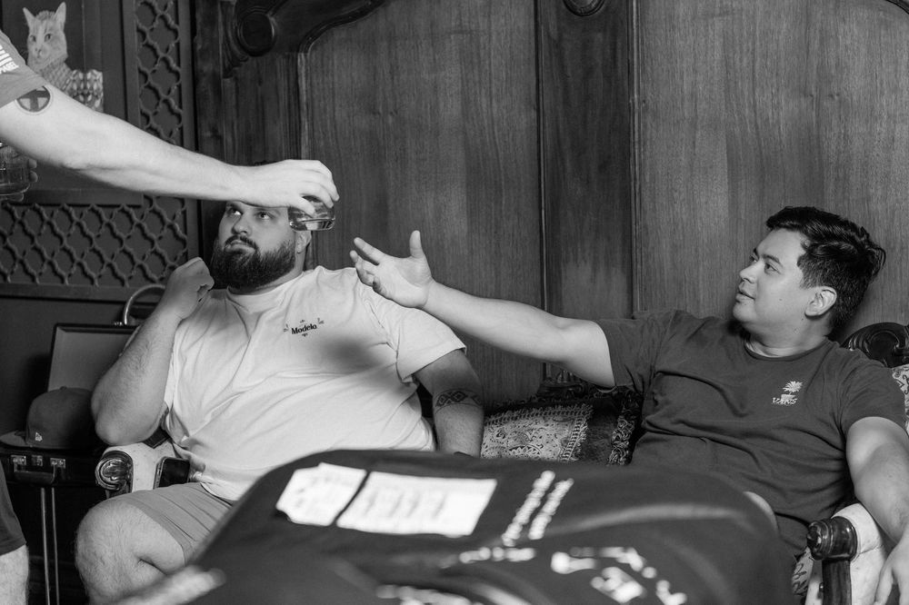 People relaxing on couches in casual attire.