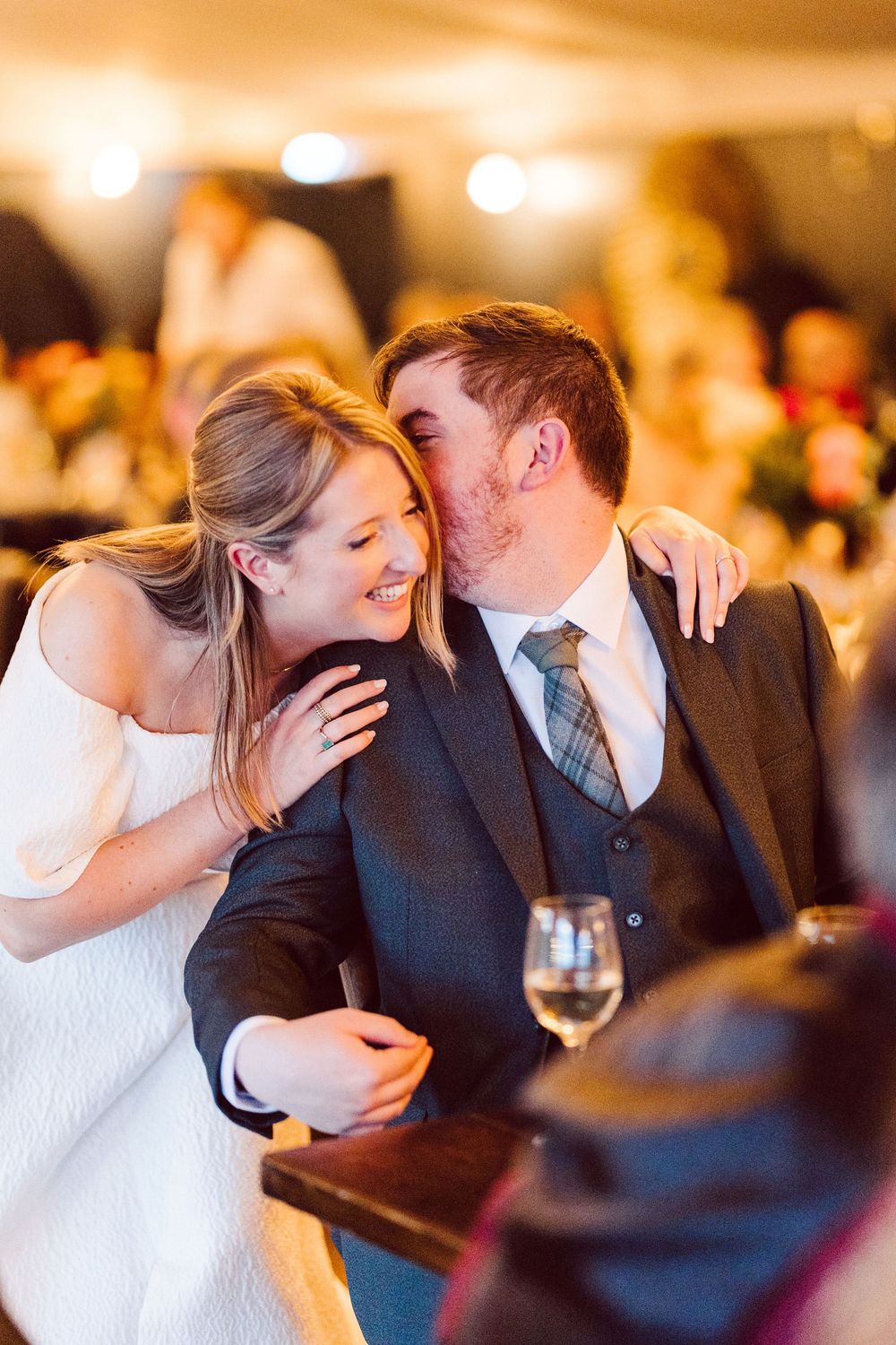 Romantic couples share intimate moments on the dance floor at an elegant wedding reception.