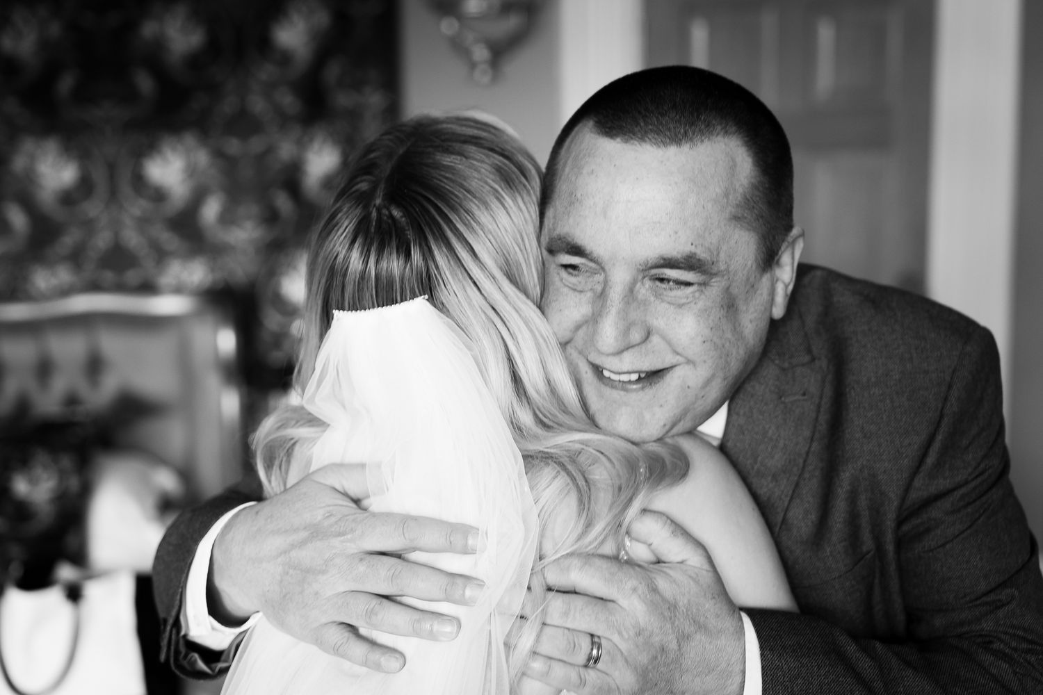 Black and white candid moments captured during an emotional wedding ceremony.