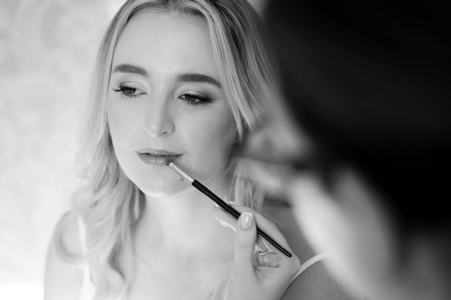 Close up beauty shot showing makeup application and preparation.