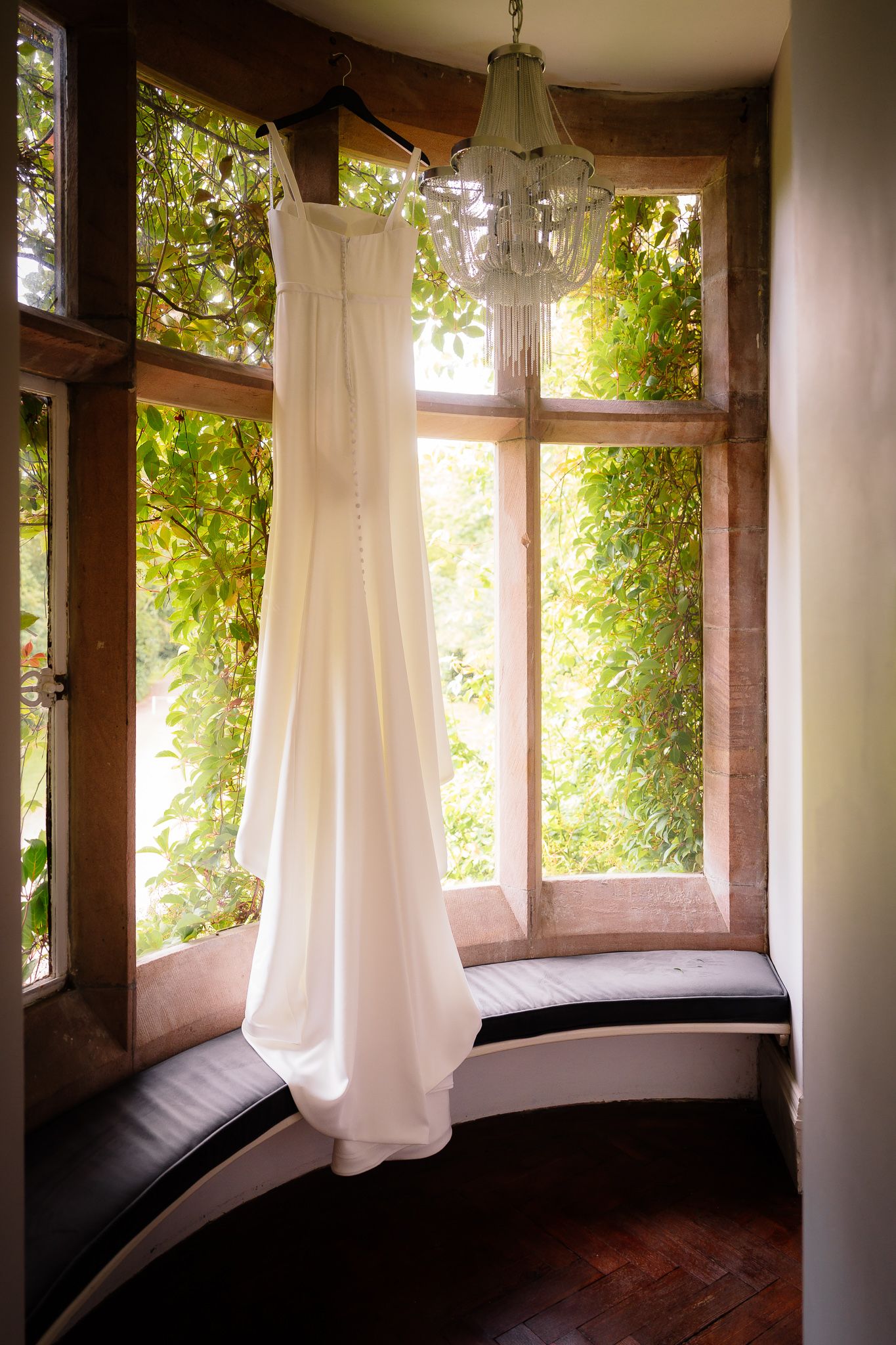 Sunlit room with white curtains and wooden beams creating a romantic atmosphere. Ellingham Hall