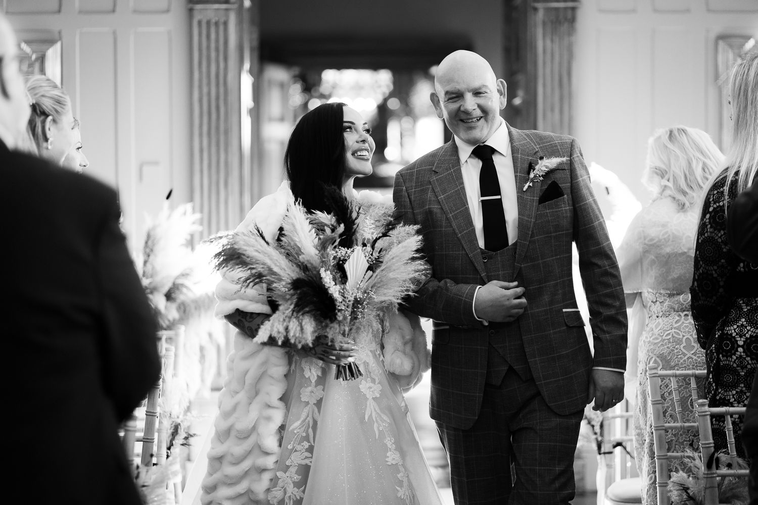 Black and white wedding ceremony photos capturing emotional moments and reactions.