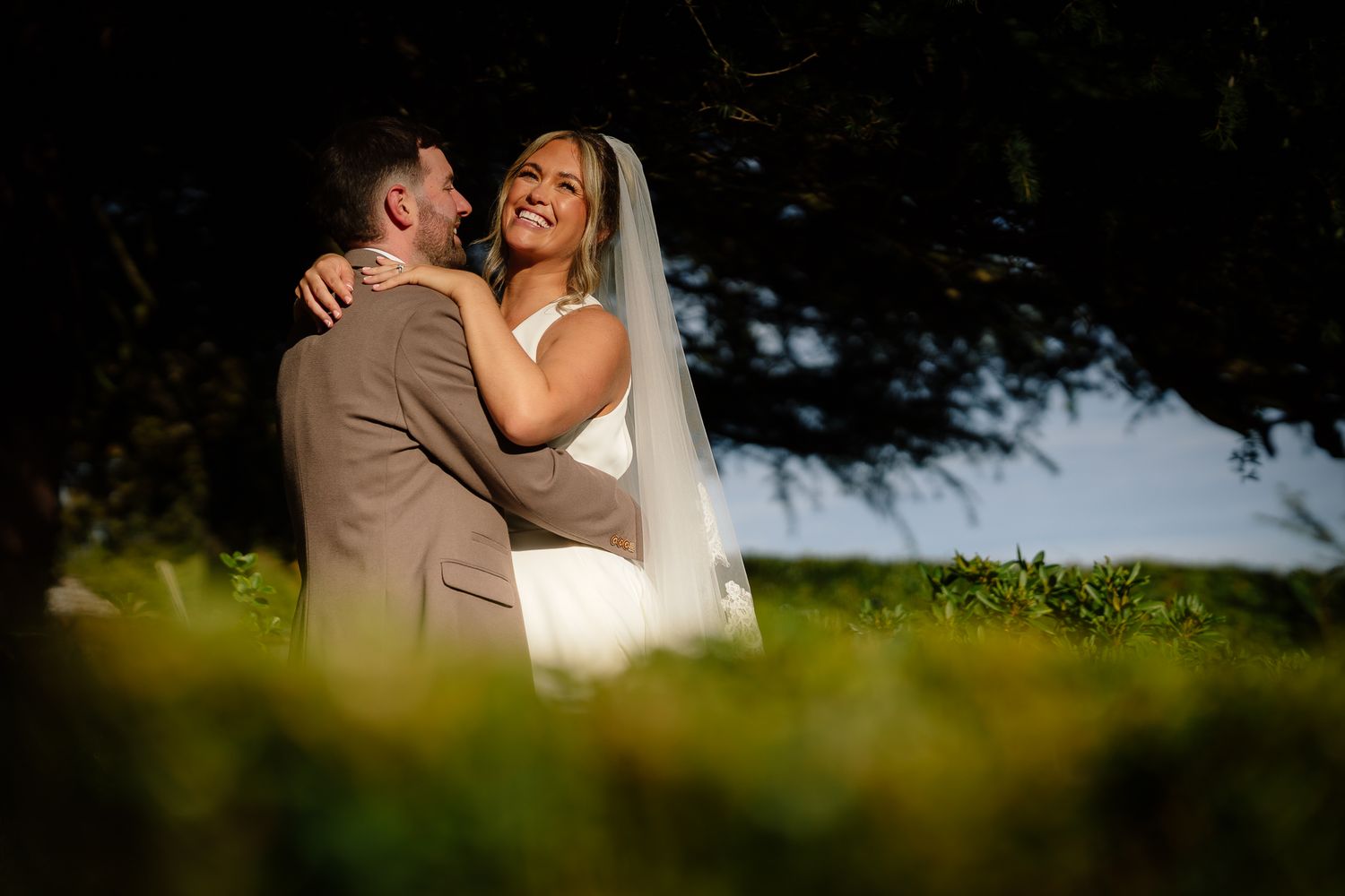 Intimate wedding couple portraits captured in natural outdoor lighting.
