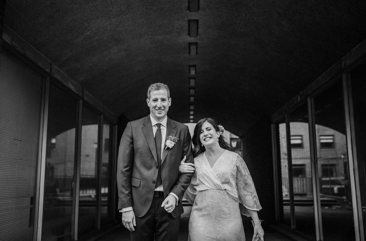 A black and white wedding photo collage showing intimate moments between a couple and their celebration.