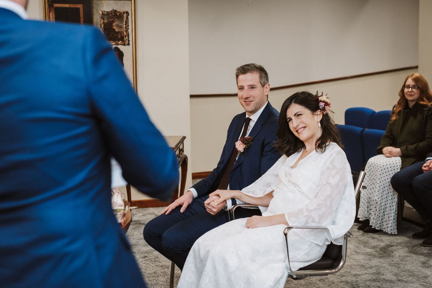 A series of photos showing people in formal attire at a wedding reception venue.