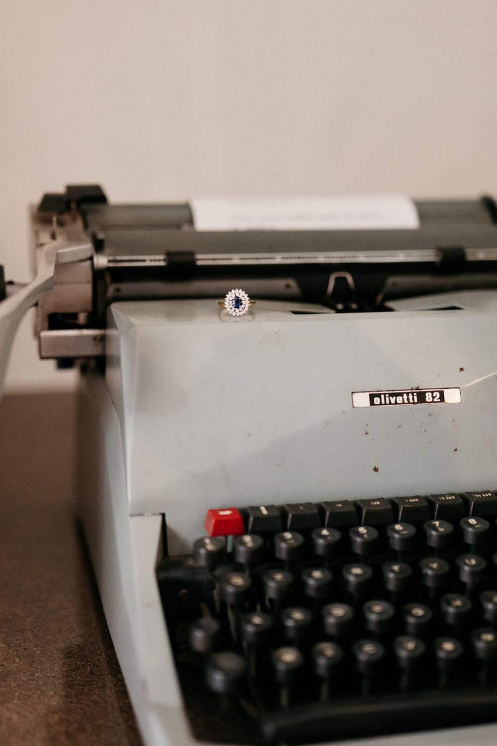 Vintage Olivetti typewriter photographed in dramatic black and white close-up.
