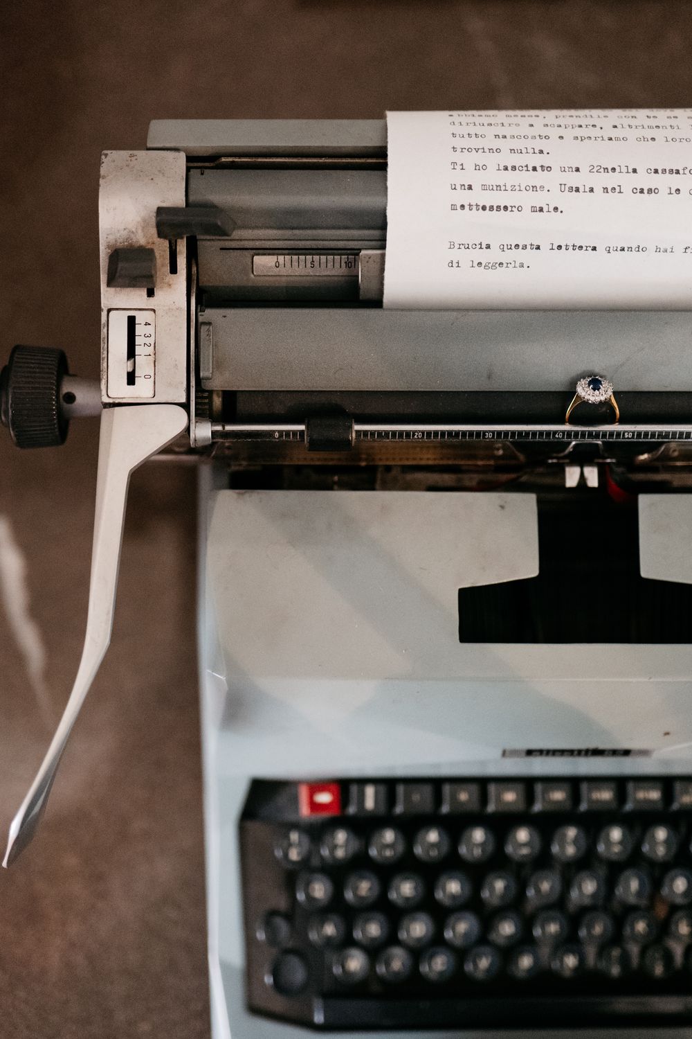 Vintage typewriter with white paper loaded, ready for writing wedding vows.