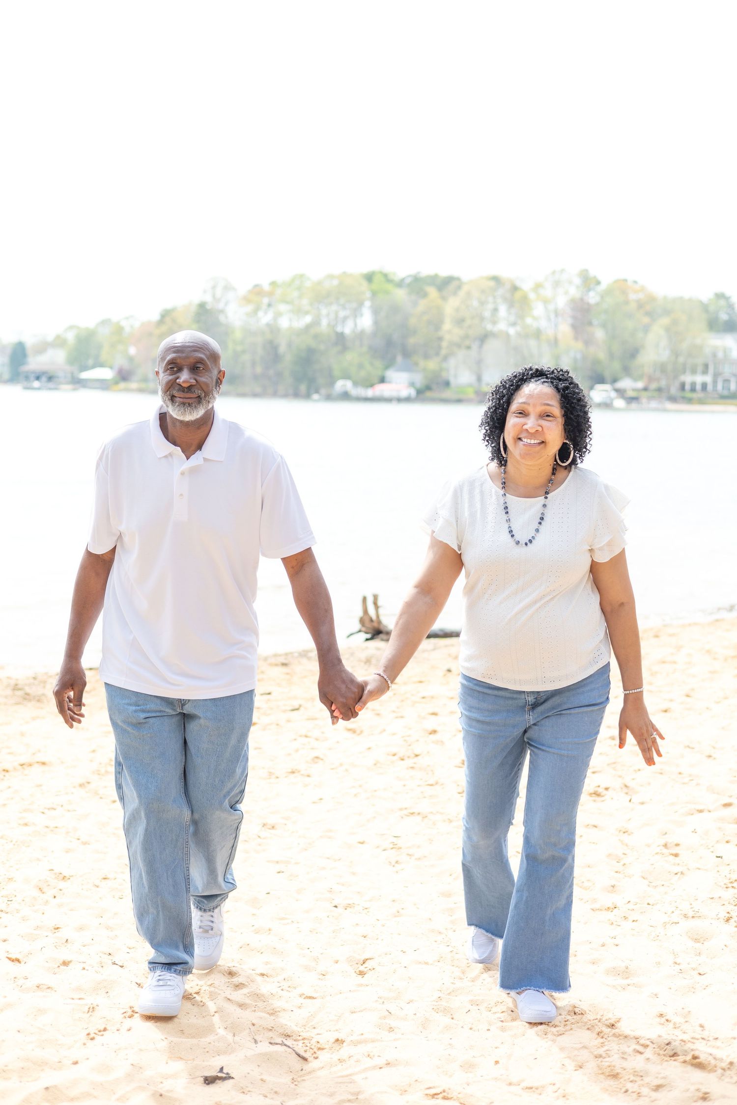 Couple celebrating their long and happy marriage on the lake at Jetton Park in Cornelius, NC.