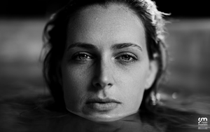 Dramatic black and white close-up portraits arranged in artistic sequence showing different angles and expressions.