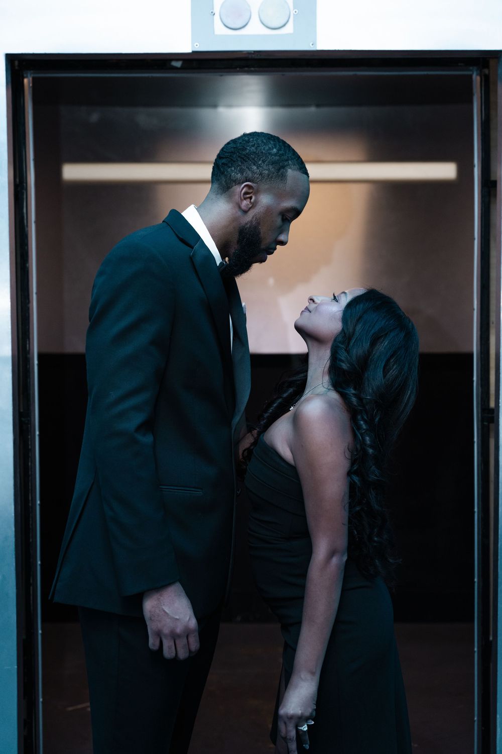 A sequence of photos showing a couple in formal attire interacting intimately in a dimly lit interior space.