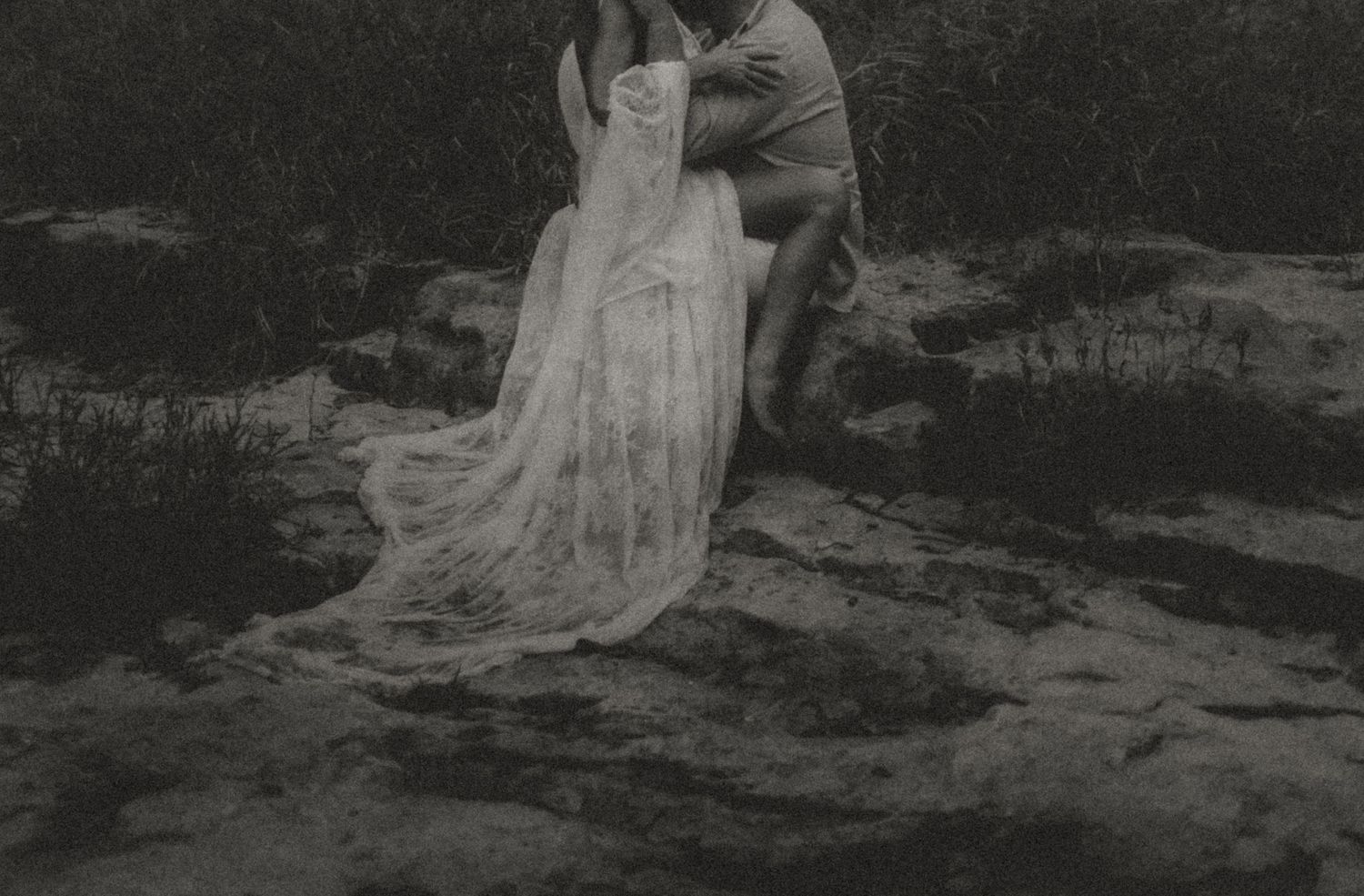 Indiana Couples Storytelling Photographer // Dramatic black and white series showing couple sitting in a dried up creek.