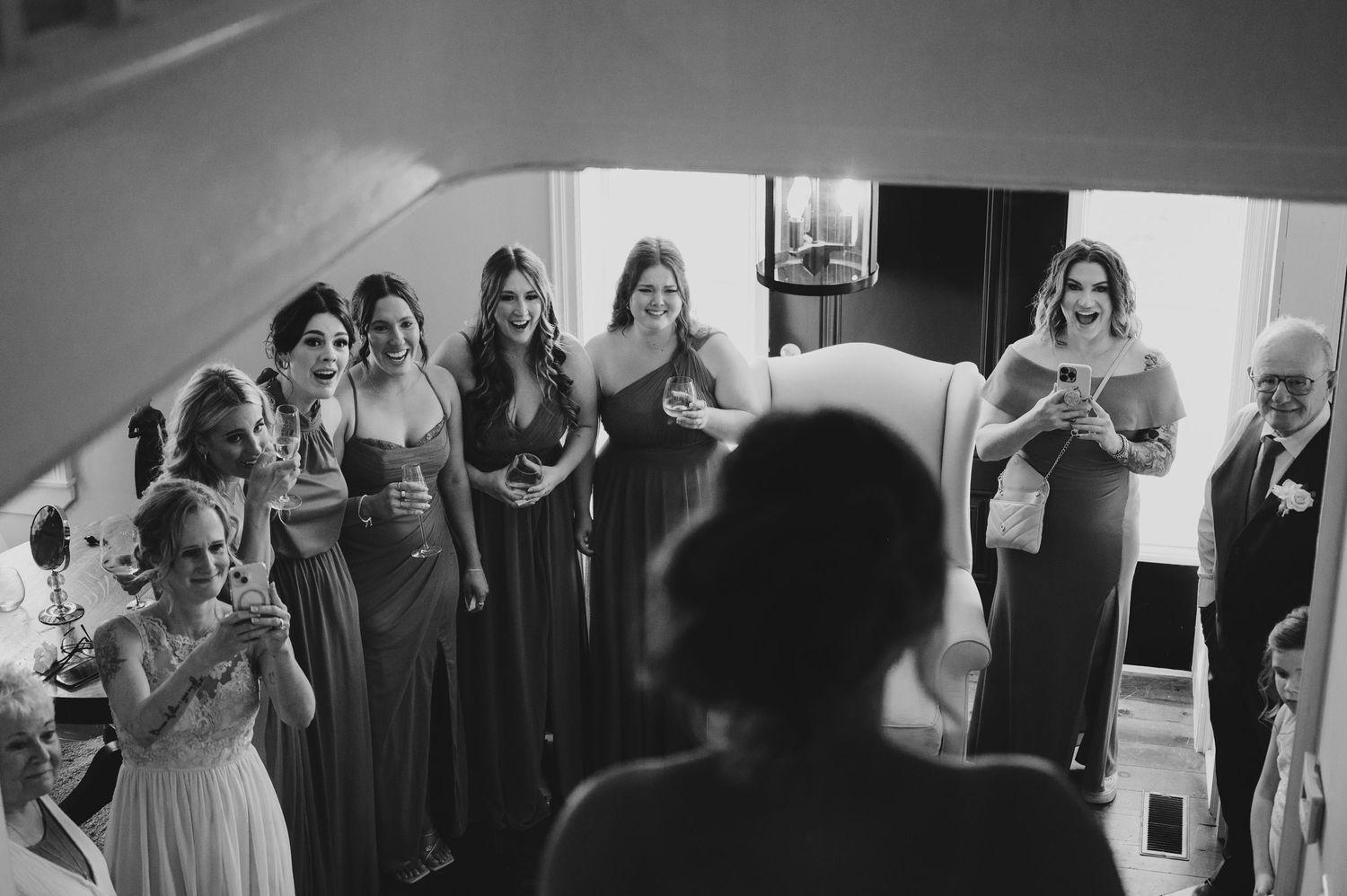 A series of candid wedding party photos showing bridesmaids in gray dresses preparing for the celebration.