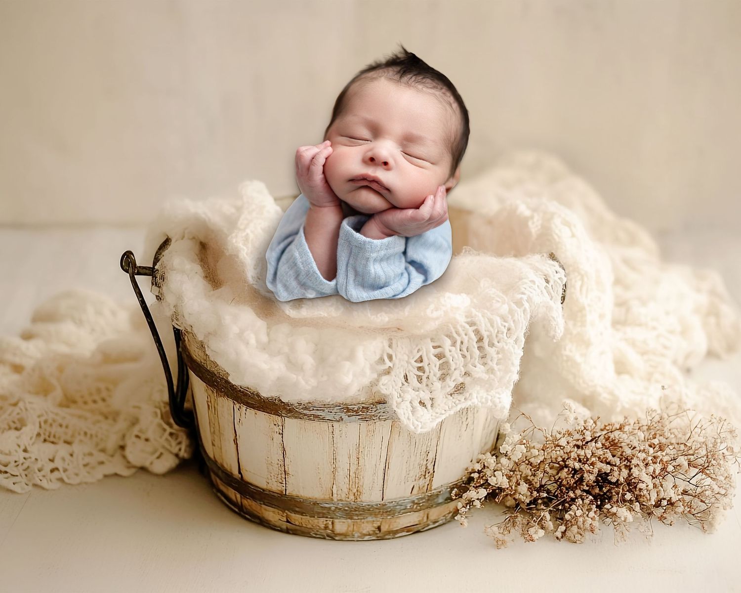 Newborn baby photography series showing peaceful sleeping infant in rustic wooden containers with soft textures.
