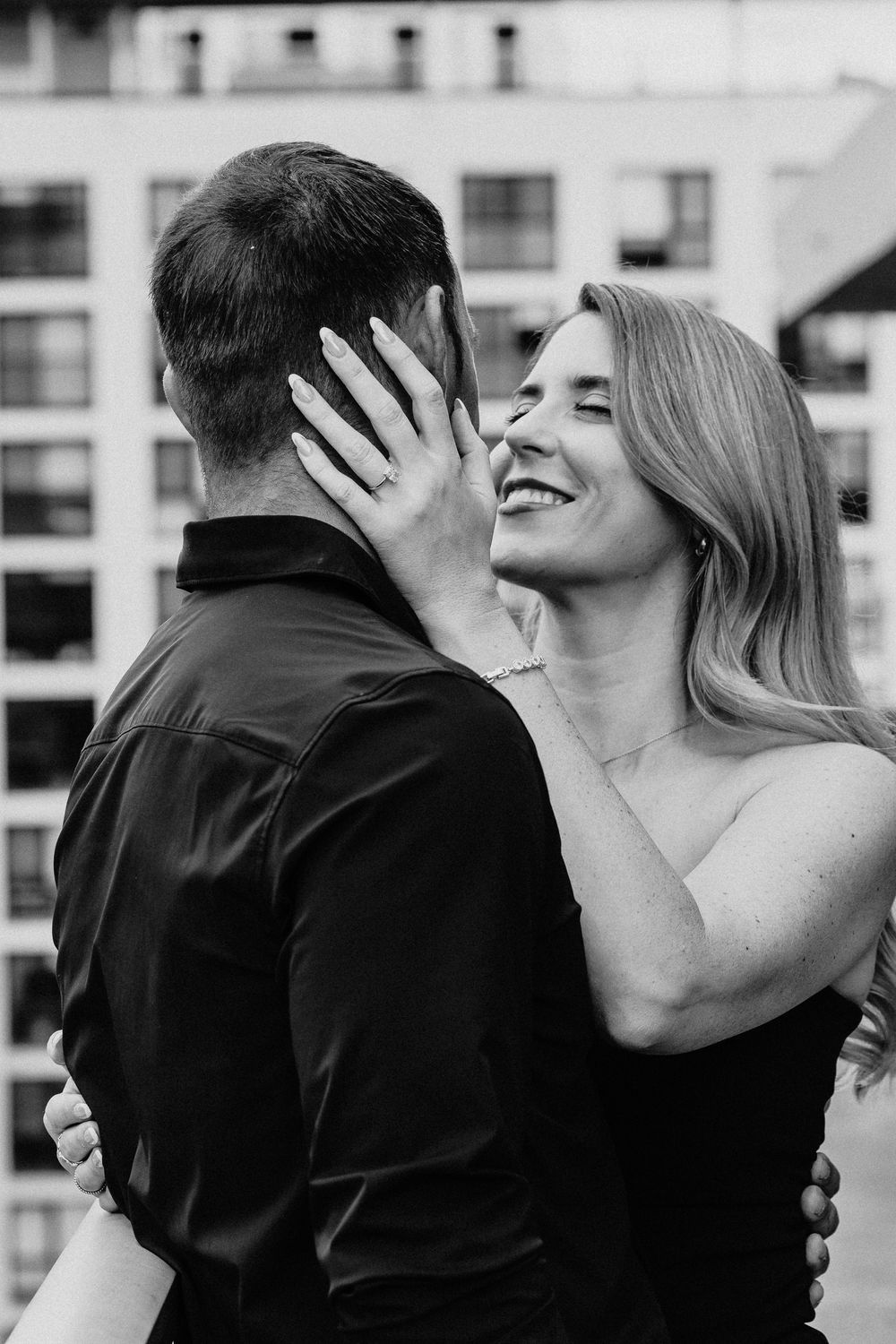 Black and white photo series showing candid romantic moments between a couple outdoors.