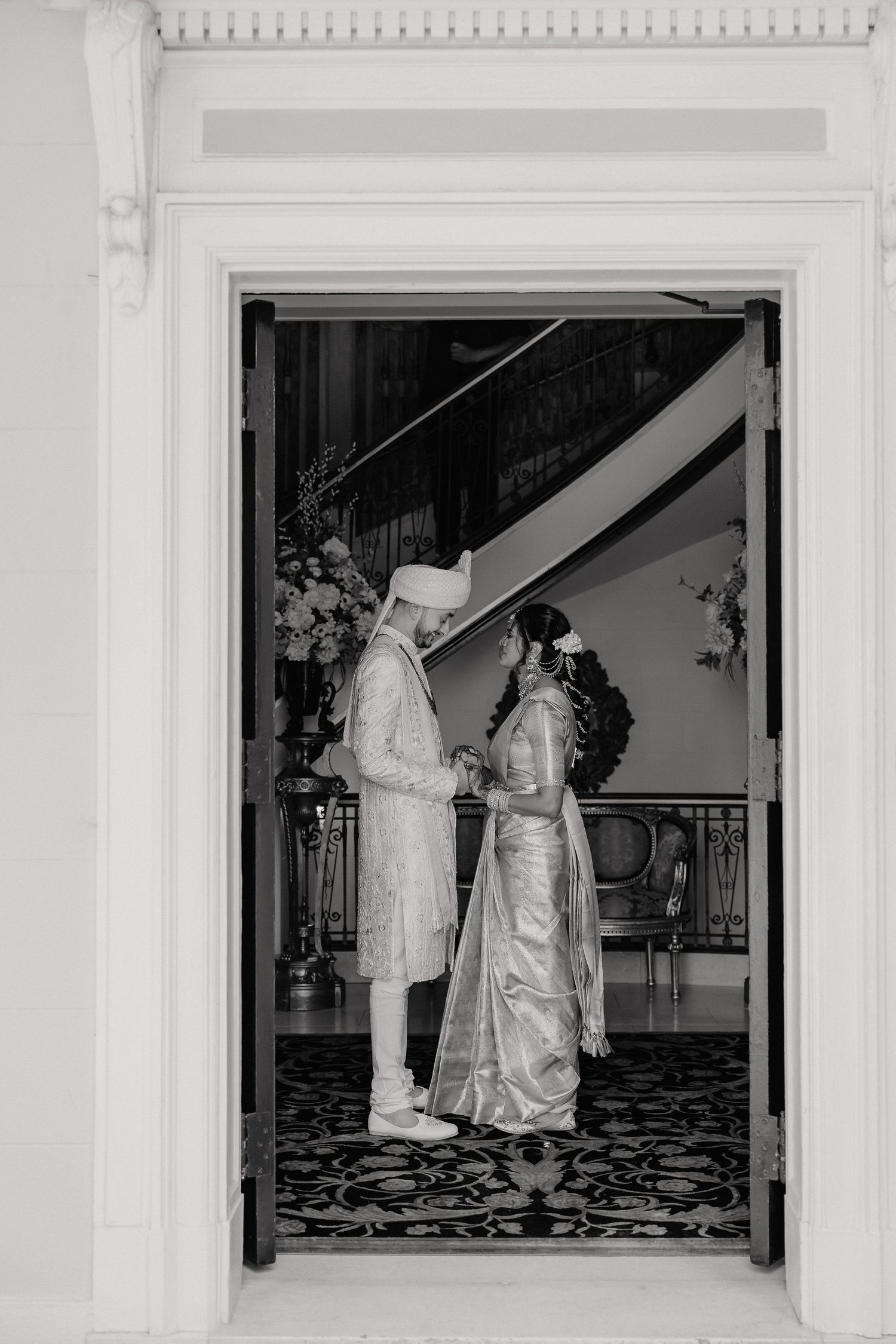 Black and white photos show wedding preparations in an ornate room with patterned floors and white walls.