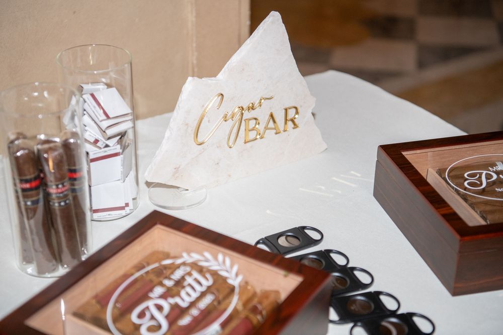 Wedding reception details showing decorative tear tissues and event signage on a table.